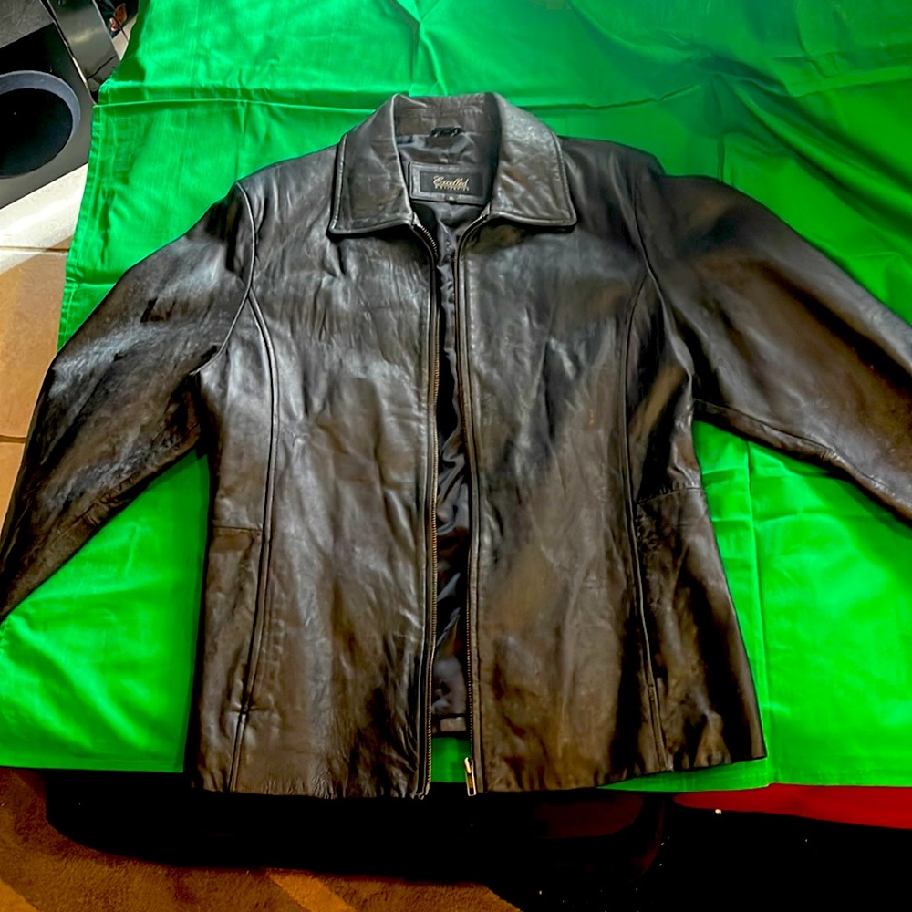 Women’s black waist length leather jacket.